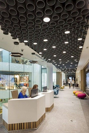 False ceiling by Zau Interiors, used to improve the acoustics and appearance of an office